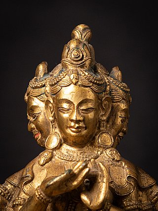 Crown and frontal face detail of Tibetan bronze Namgyälma with side faces behind