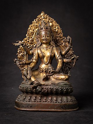 Gilt-bronze Vasudhara statue from Nepal, seated front view with multiple arms and halo