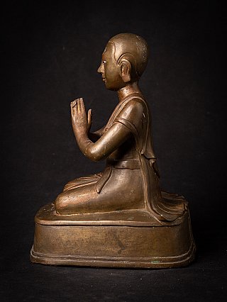 Burmese bronze monk statue seated, left side profile with Namaskara mudra