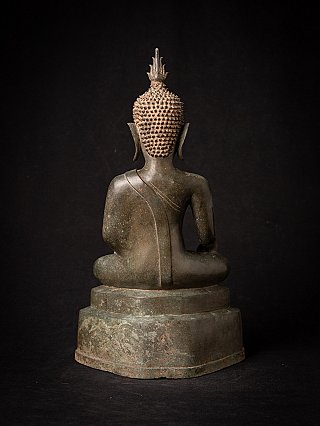 Thai bronze Buddha statue, rear view showing curled hair and finial