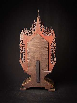 Rear view of the wooden Buddha throne showing support strut and openwork outline