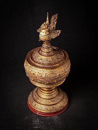 Top view of the gilded Burmese offering vessel, showing the lid pattern and bird finial