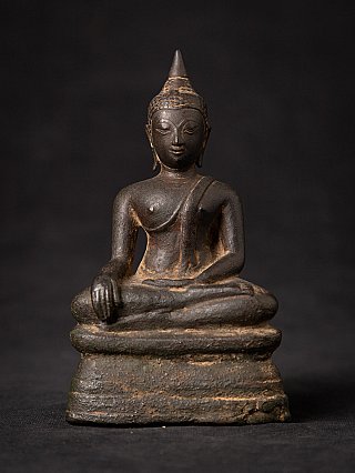 Thai bronze Buddha statue seated in bhumisparsha mudra, full-front view on tall base