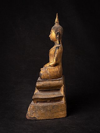 Antique wooden Thai Lanna Buddha statue