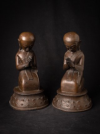 Burmese bronze monk statues seated in namaskara mudra, straight-on front view