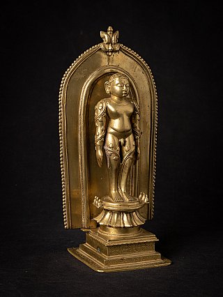 Jain shrine from India with standing figure, three-quarter view with niche and stepped base