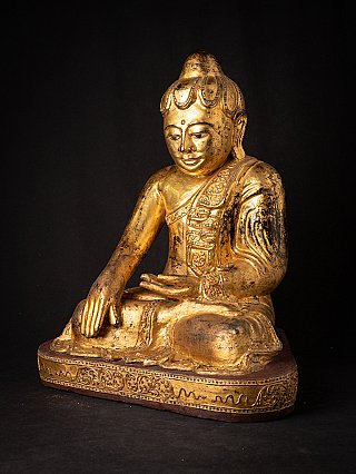 Burmese wooden Buddha statue with gilding, three-quarter right view