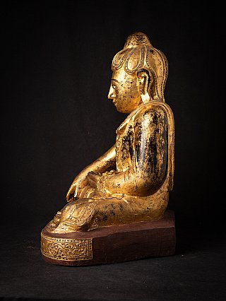 Burmese wooden Buddha statue, seated, right side profile with base visible