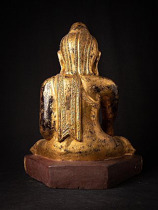 Burmese wooden Buddha statue with gilding, rear view showing robe down the back