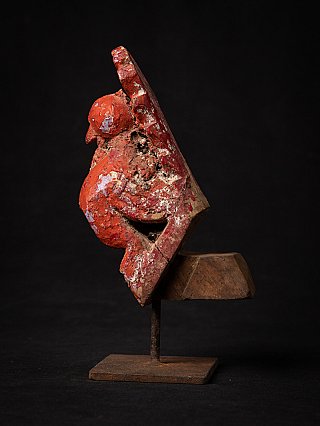 Indian wooden bird statue with red pigment, side profile with projecting mount