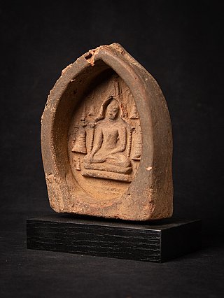 Burmese wooden votive tablet with seated Buddha, three-quarter left view