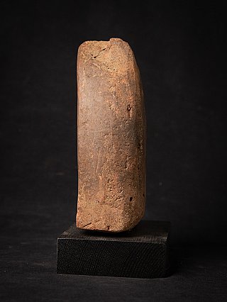 Side profile of the Burmese wooden votive tablet showing thickness and wear