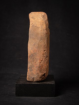 Side profile of the Bagan votive tablet showing the thickness and worn edge
