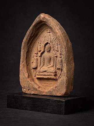 Votive tablet from Myanmar with seated Buddha relief in niche, three-quarter left view