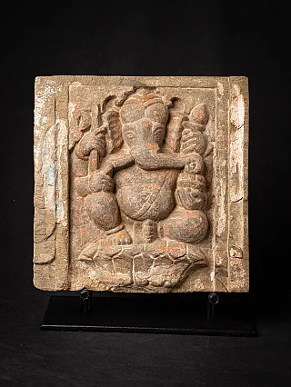 Indian Ganesha relief panel on stand, frontal view with traces of pigment