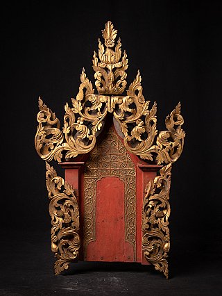 Antique Burmese wooden temple panel, full front view with red lacquered field and gilded carving