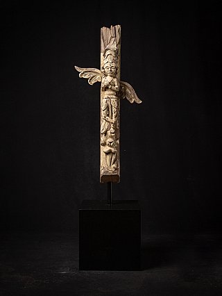 Antique wooden temple figure from India, full front view of standing figure with spread wings