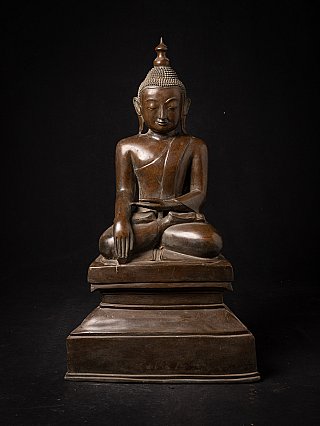Burmese bronze Buddha statue seated in bhumisparsha mudra, full front view on stepped base