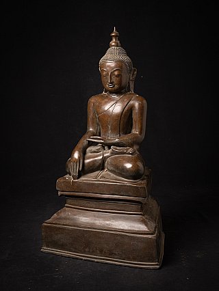 Bronze Buddha statue from Burma (Myanmar), seated, three-quarter right view on tiered base