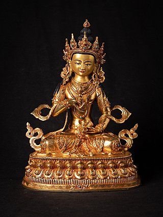 Vajrasattva statue in Nepali bronze with gold-coloured face, seated on ornate base, front view