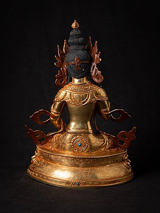 Rear view of the Nepali bronze Vajrasattva statue showing hair arrangement and engraved details
