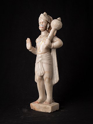Marble Hanuman statue in three-quarter view, holding a mace over the shoulder