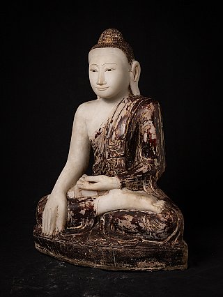 Mandalay-style marble Buddha statue, seated, three-quarter view showing painted robe