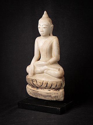 Marble Buddha statue from Burma in Shan style, three-quarter view showing lotus base