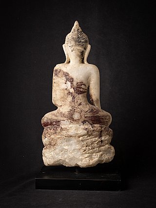 Marble Buddha statue from Burma, rear view with dark staining and rough base section