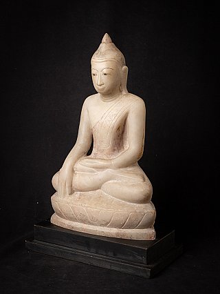 Burmese marble Buddha statue, three-quarter left view showing the pedestal base