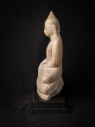 Seated Burmese marble Buddha statue, left side profile on black display base