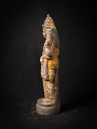 Vishnu statue from India in side profile, showing long hair and round base