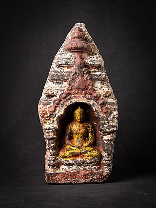 Thai marble Buddha statue seated in dhyana mudra in arched niche, full front view
