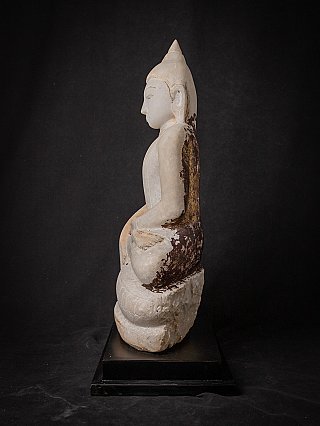 Burmese marble Buddha statue seated, left side profile view