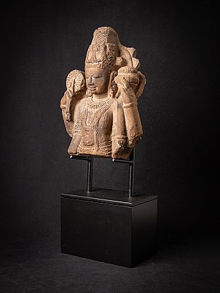 Vishnu stone bust on stand, three-quarter left view