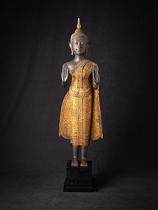 Thai bronze Buddha statue standing in Abhaya mudra, full front view on black base
