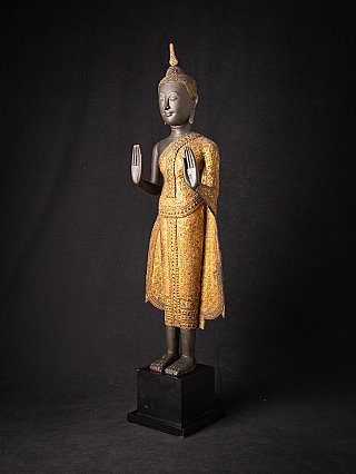 Bronze Thai Buddha statue standing in Abhaya mudra, three-quarter left view