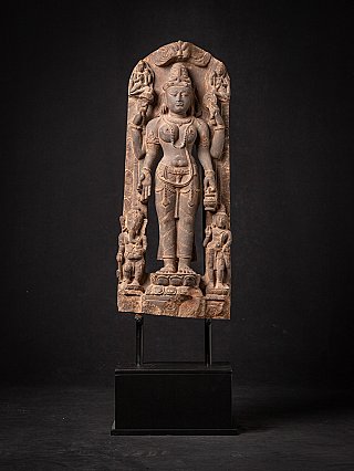 Saraswati statue relief with two attendant figures, full front view on stand