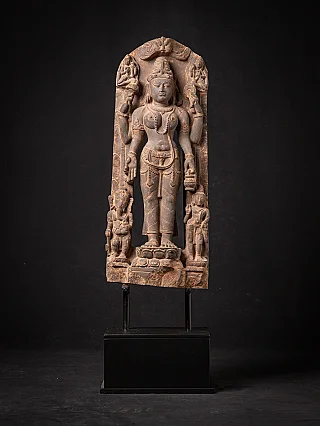 Saraswati statue relief with two attendant figures, full front view on stand