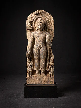 Buddha statue from India in wood, full front view within carved niche on black base