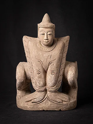Burmese Nat statue seated, full front view with tall pointed headdress