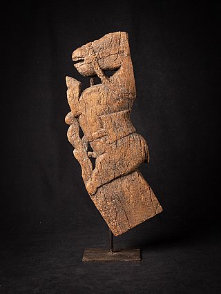 Wooden Indian temple fragment of a horse, left side view on metal stand