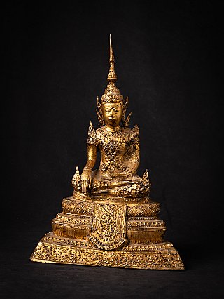 Thai bronze Buddha statue seated on ornate tiered base, front view in bhumisparsha mudra