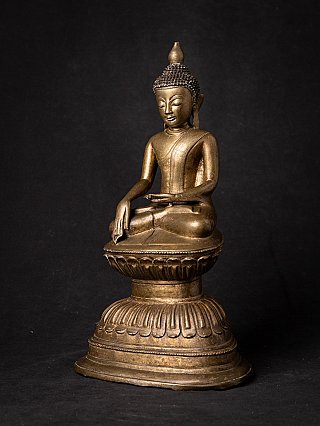 Bronze Buddha statue from Burma (Myanmar) seated on lotus base, three-quarter view