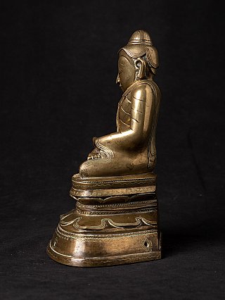 Bronze Buddha statue from Burma (Myanmar), side profile of the seated figure on lotus base