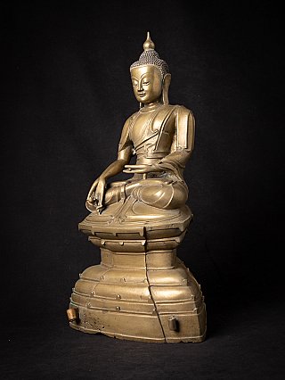 Bronze Buddha statue from Burma (Ava period), three-quarter view on tall base