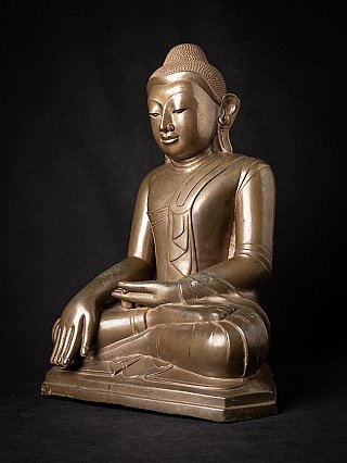 Burmese bronze Buddha statue in bhumisparsha mudra, three-quarter view