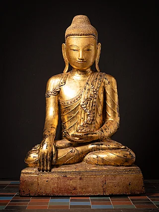 Burmese Buddha statue in lacquerware, seated in bhumisparsha mudra, full front view