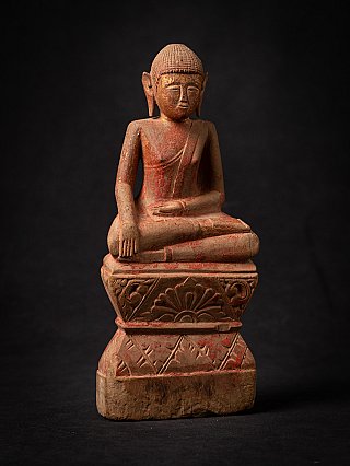 Thai wooden Buddha statue seated in bhumisparsha mudra, slightly angled front view