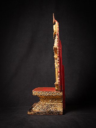 Antique Mandalay wooden throne, side profile with red backboard and gilded base